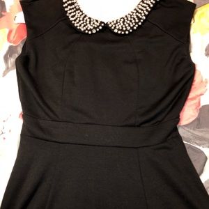 Small little black dress with pearl collar